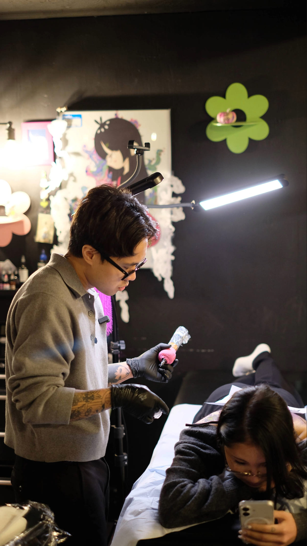 Neil Guban tattooing at his studio